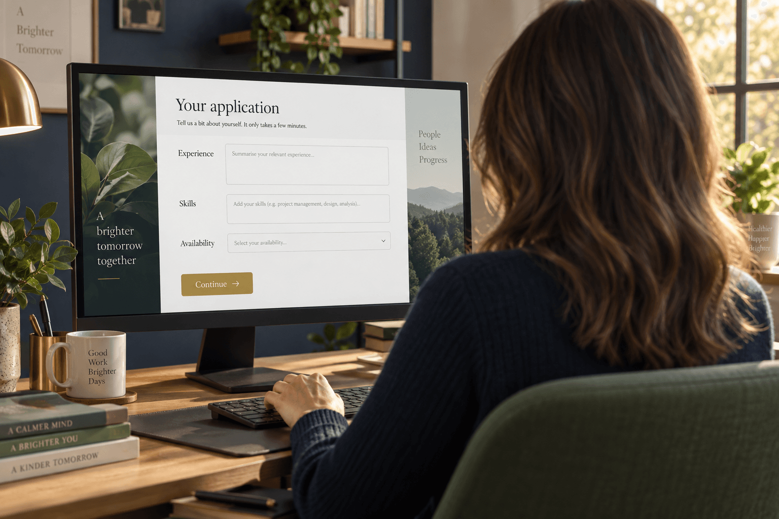 Illustrative photograph: Professional completing a skills application form on a PC, seen from behind